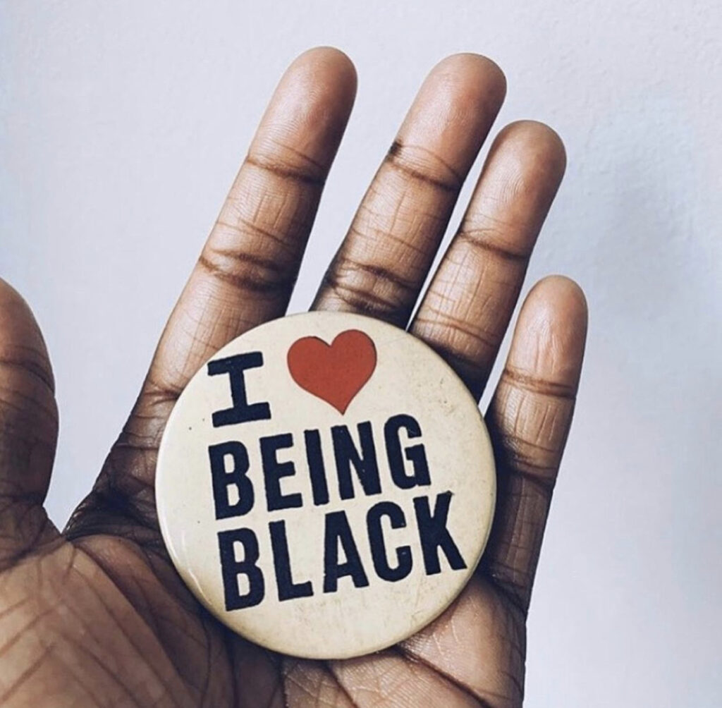 I-Love-Being-Black-Pin-Held-in-Hand
